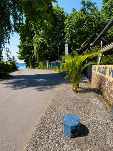 a blue barrel sitting on the side of a road at Casa Dolce Vita in Puerto Viejo