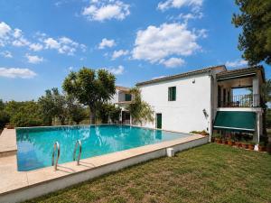 a swimming pool in the backyard of a house at Casa Canciones in Alzira