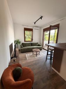 a living room with a couch and a table at Iva Apartment in Kumbor