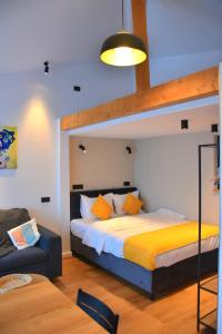 a bedroom with a bed and a loft bed at Cozy Cribs Rasnov in Râşnov