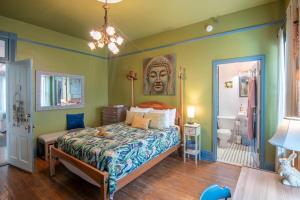 a bedroom with a king sized bed and a bathroom at Birmingham Tree House in Birmingham