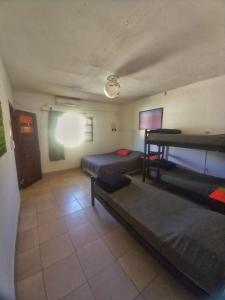 a room with two bunk beds in a room at Huaka Guesthouse and Hostel in Cafayate