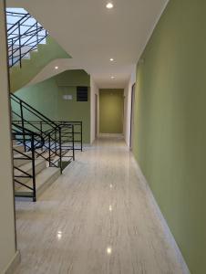an empty hallway with stairs in a building at OCEAN Hotel Miami in Toamasina