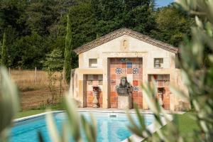 a building with a pool in front of it at Château De Chambiers in Durtal