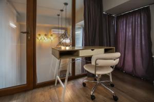 a desk and a chair in a room at Vake Dream Duplex in Tbilisi City