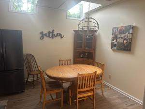 a dining room table with chairs and a chandelier at Inn at the Old Silk Mill in Fredericksburg +46 photos