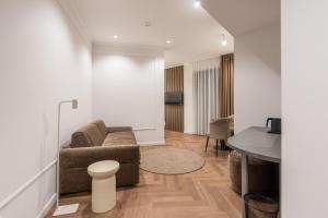 a living room with a couch and a table at Hotel Bulevar Mostar in Mostar