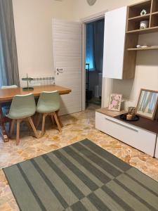 a kitchen with a table and chairs in a room at Nicole's House in Asti +25 photos