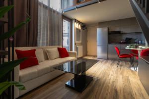 a living room with a couch and a table at Vake Dream Duplex in Tbilisi City +95 photos