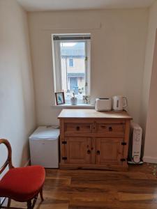 a bathroom with a sink and a window at Fairways in Melrose