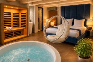 a hotel room with a bed and a tub at Life VOYAGE Résidence & Spa by Life Renaissance - Place KLEBER in Strasbourg