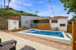 a swimming pool in the backyard of a house at Casa Docia Hotel in Santa Bárbara de Samaná