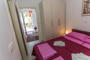 Posteľ alebo postele v izbe v ubytovaní Apartments Palma Ragusa