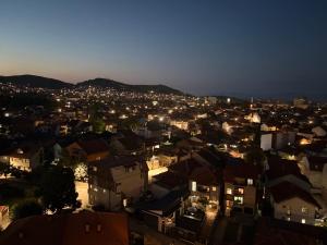 a view of a city at night at Matey Luxury Sky Apartment in Bitola