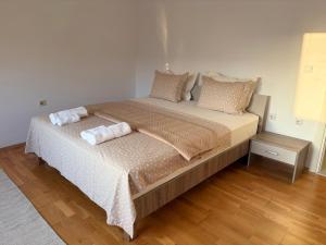 a bedroom with a bed with two pillows on it at Matey Luxury Sky Apartment in Bitola