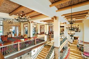 an image of the lobby of a resort with chandeliers at JW Marriott Tucson Starr Pass Resort in Tucson