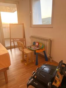 a small room with a table and a chair at Matey Luxury Sky Apartment in Bitola
