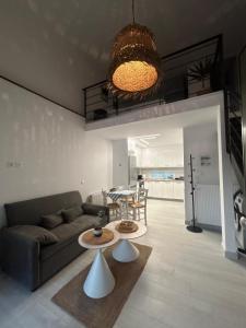 a living room with a couch and a table at Elia Apartments in Eretria