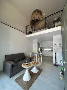 a living room with a couch and a table at Elia Apartments in Eretria +4 photos
