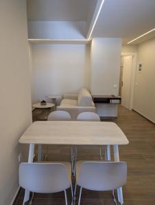 a room with a table and chairs and a couch at Thelea Mani in Kafióna +159 photos