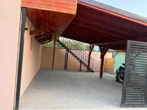 a patio with a staircase and a building at Casa Marza in Făgăraş