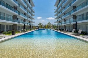 a swimming pool in the middle of a building at Nuevo Vallarta Peaceful Loft in Nuevo Vallarta