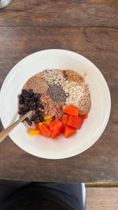 a plate of food with grains and vegetables on a table at Blue Dot - jungle river adventure hostel closest to Ciudad Perdida in Santa Marta