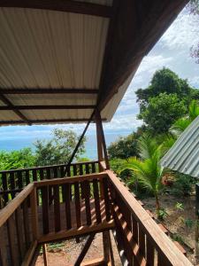 a view of the ocean from the balcony of a house at Cumbilinchero Selva Mojada in Nuquí