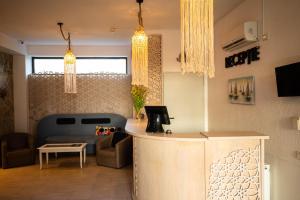 a living room with a couch and a table at Kazeboo Bed & Breakfast in Mamaia Sat/Năvodari