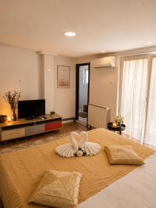 a bedroom with a bed with a flower on it at Nature Bliss Villa in Sarajevo