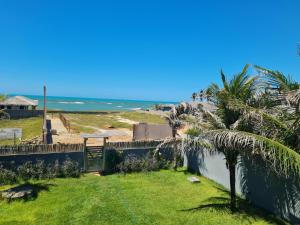 a view of the ocean from the balcony of a house at Casa Bea in Fortim