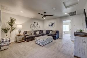 a living room with a couch and a bike on the wall at Desert Oasis in Washington