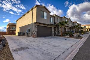 a large house with a garage on a driveway at Desert Oasis in Washington