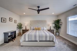 a bedroom with a bed and a desk and a ceiling fan at Desert Oasis in Washington +24 photos