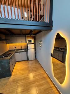 a kitchen with white cabinets and a staircase at Villa Royal in Imperatriz