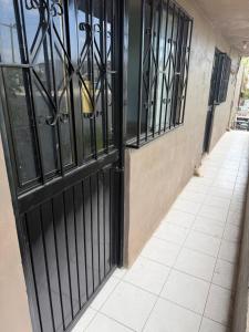 an entrance to a building with black wrought iron doors at HM cuarteria cangrejos in Cabo San Lucas