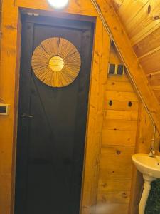 a door to a bathroom with an umbrella on it at Mountain heaven in Andrijevica