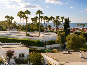 an aerial view of a resort with palm trees and the ocean at Solymar Premium Apartment 2 in Playa del Ingles