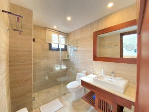 a bathroom with a sink and a shower and a toilet at Charming two-bedroom apartment in Las Terrenas in Las Terrenas +9 photos