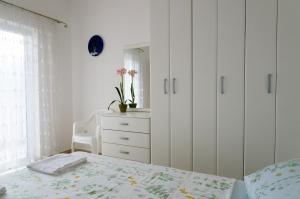 Ένα ή περισσότερα κρεβάτια σε δωμάτιο στο Apartment Begonia of Kumbor