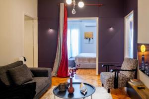 a living room with a couch and a table at 4 Travelers in Thessaloniki