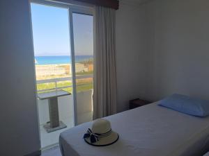 a room with a bed with a hat on it at Annabel Apartments in Theologos