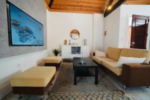 a living room with a couch and a table at Loft beach in Vieira de Leiria