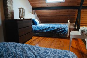 a bedroom with two beds and a wooden floor at Loft beach in Vieira de Leiria +38 photos