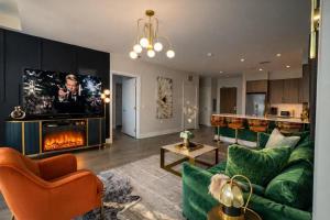 a living room with a couch and a fireplace at The Casa - U Street in Washington, D.C.