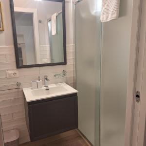 a bathroom with a sink and a shower at Casa Sant'Antonio Dimora Storica in Tarquinia +19 photos