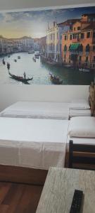 a row of beds with a view of a canal at Hotel Alvorada do Sol in São Paulo +7 photos