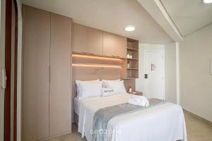 a small bedroom with a bed and a closet at Studio in Condo with Pool and Gym MSU0906 in Governador Valadares