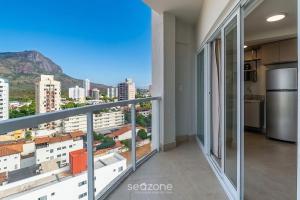 a balcony with a view of the city at Studio in Condo with Pool and Gym MSU0906 in Governador Valadares