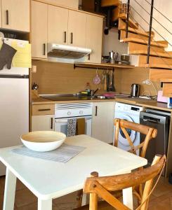 a kitchen with a table with a bowl on it at Mi Casa in Majanicho +17 photos